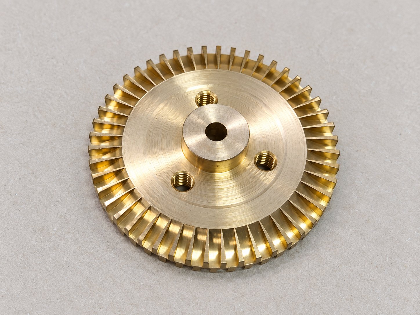 Brass pump impeller with full-circumference vanes, shaft bore and three tapped holes, CNC machined by CPS Machining Thailand, Bangkok